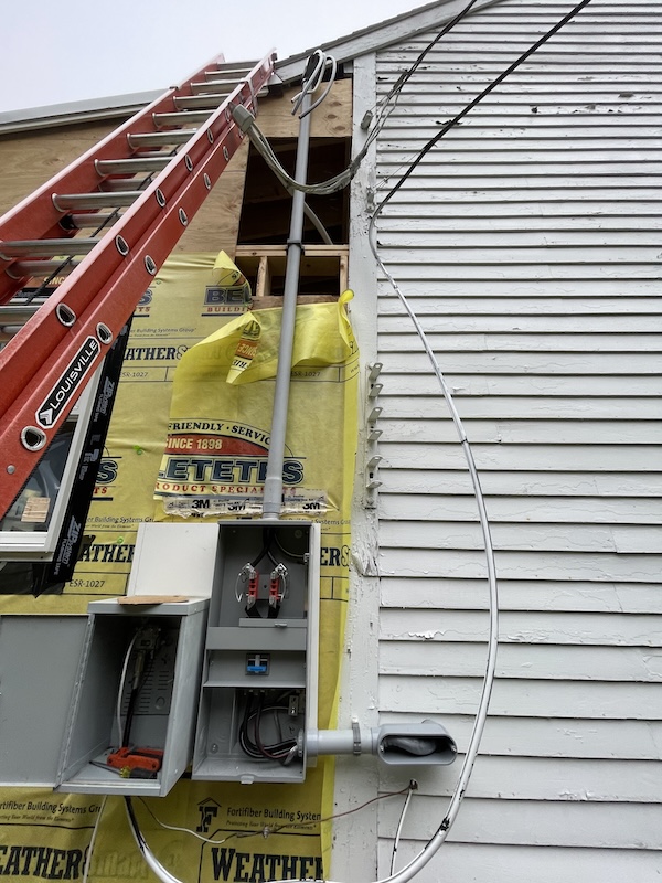 Exterior view of the barn expansion. The electrical service has been rotated and moved to the exterior of the new addition to the building.