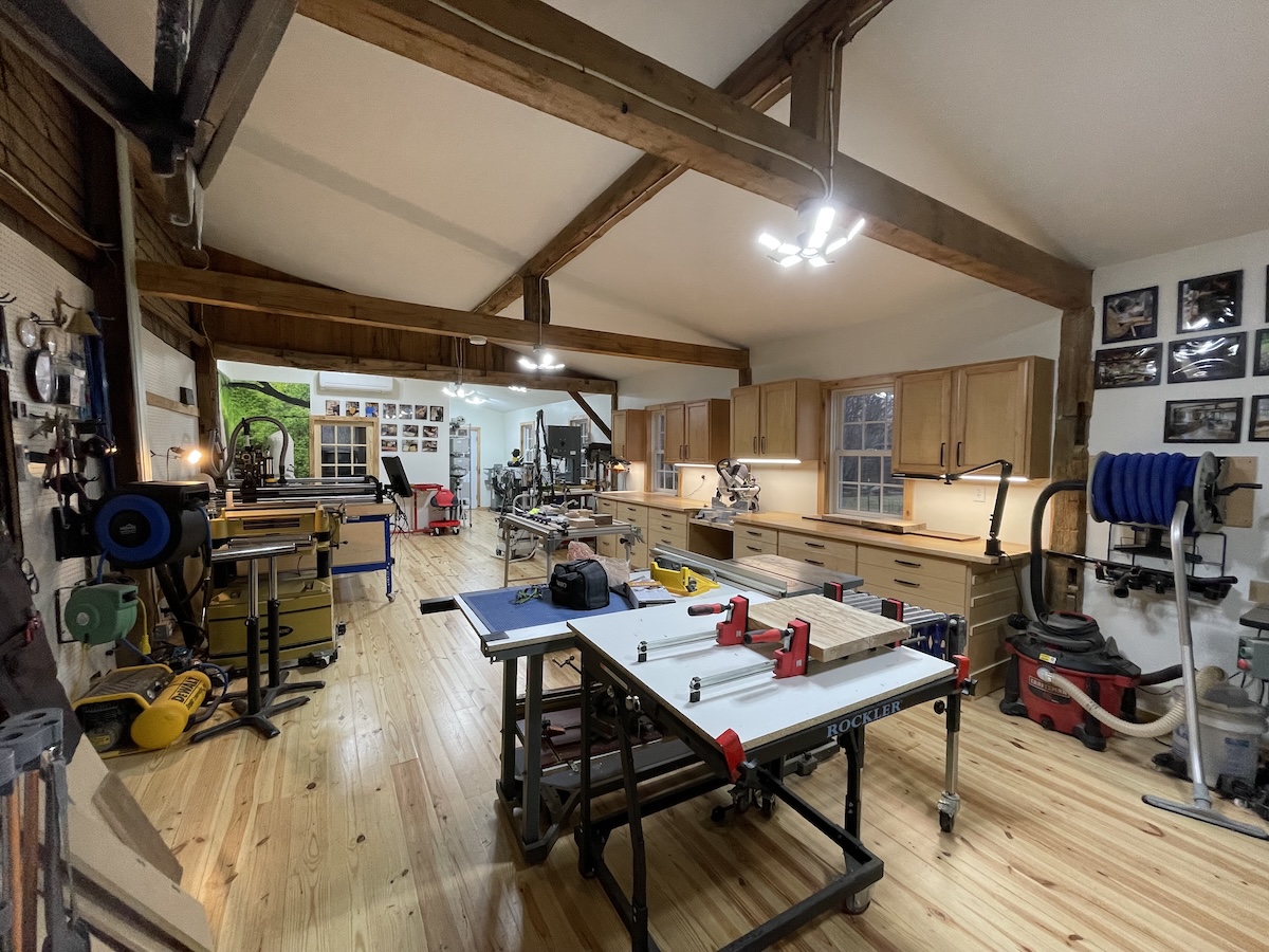 Interior view of the finished barn-to-woodworking space conversion with custom 120V and 240V dual-voltage floor boxes.
